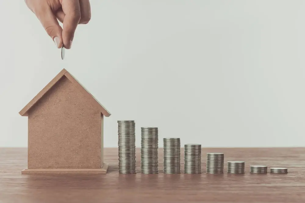 Coins going into a home signifying savings on move related products and services