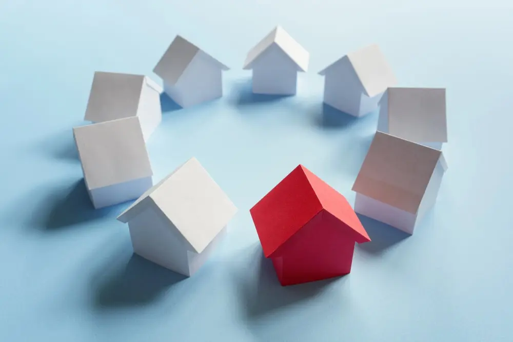 Series of houses, one red which is tanding out above the rest